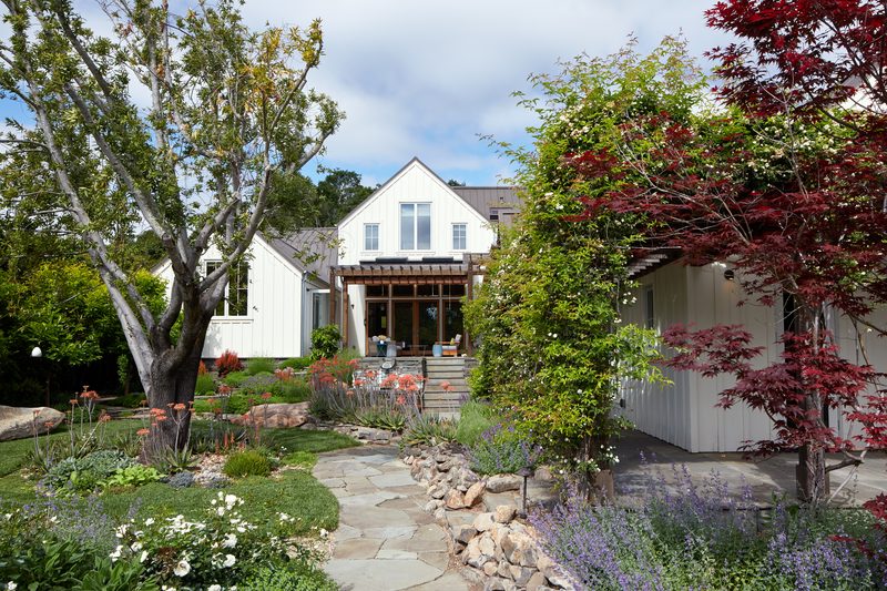 Classic farmhouse front with cottage garden