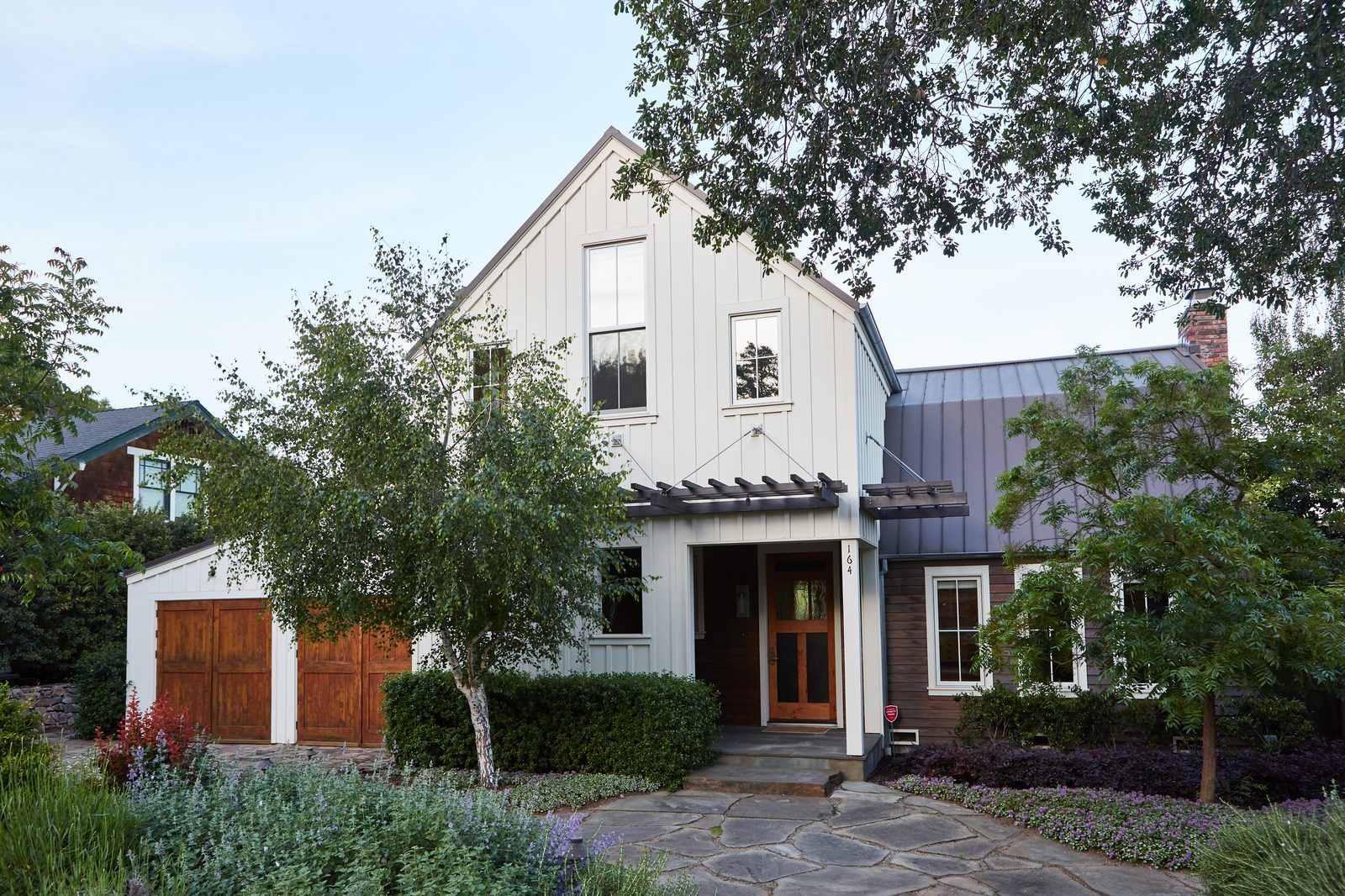Modern farmhouse front exterior at golden hour