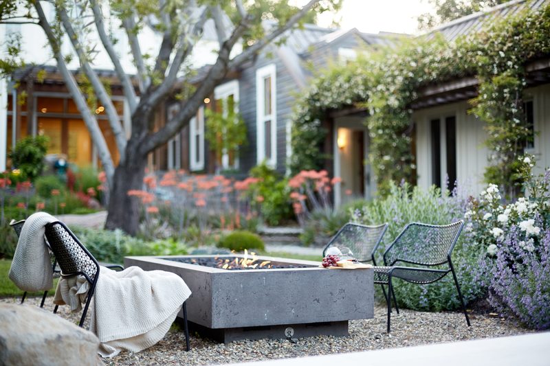 Fire pit at twilight with garden